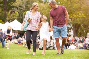 Parents with their daughter at the farmers market