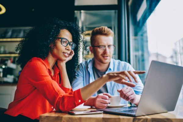 two people analyzing usr research findings