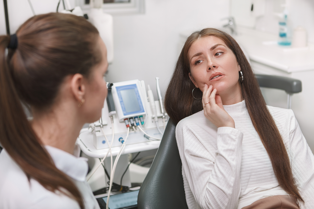 woman at the dentist with mouth pain