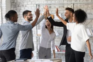 team high fiving