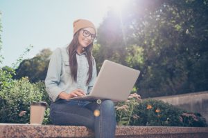 woman typing on a laptop