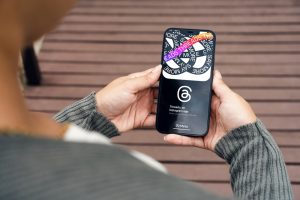 woman using threads app on phone